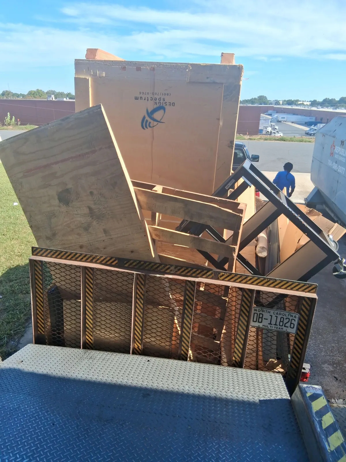 Trailer loaded with crating, pallets and commercial debris outside a Charlotte, NC warehouse
